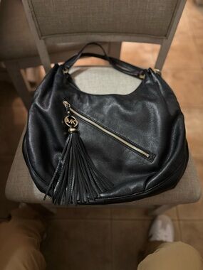 Michael Kors Black Leather Hobo with Tassel and Gold Hardware